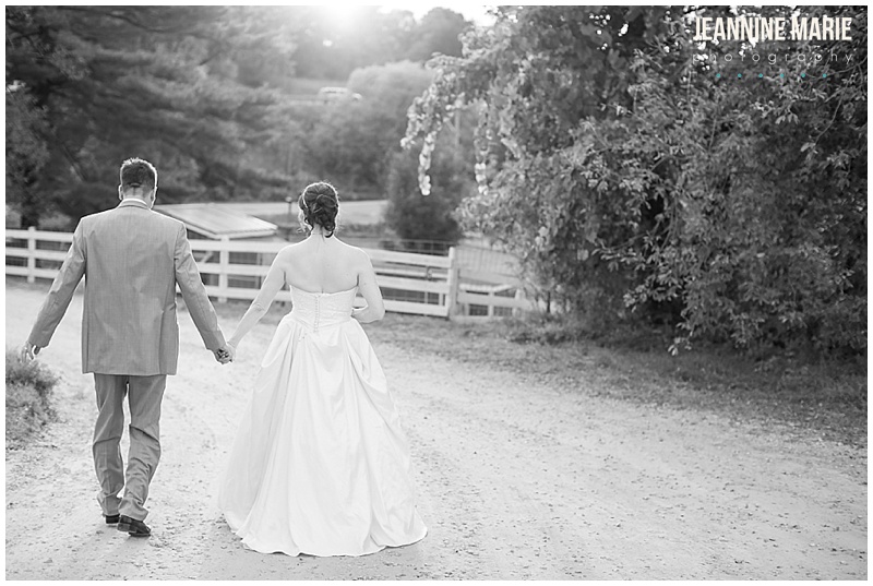 Hope Glen Farm, driveway, dirt road, outdoors, tree, white fence, bride, groom, holding hands