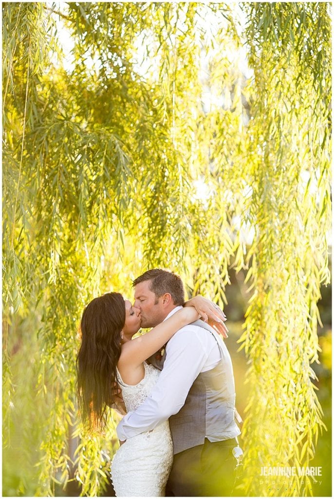 bride, groom, kiss, willow trees, sunset, Rolling Ridge Event Center, St. Cloud Floral, Custom Catering by Short Stop, Cold Spring Bakery, Geyer Wedding and Events, DJ Koeltrain, SM Hair and Makeup, The Wedding Shoppe, David's Bridal, Men's Wearhouse, barn wedding, rustic wedding, outdoor wedding, summer wedding, kid-friendly wedding