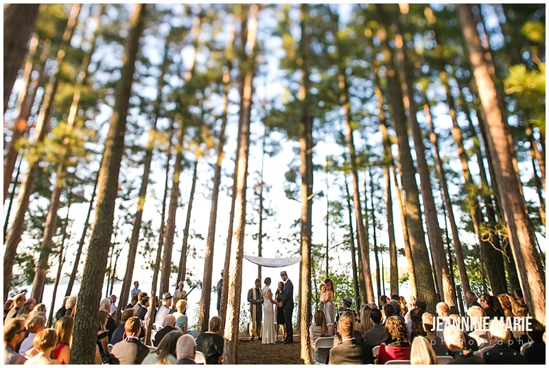 trees, wedding ceremony, guests, wide shot, bride, groom, chuppah, Camp Thunderbird, Lumberjack wedding, camping wedding, woodsy wedding, wedding in the woods, Bemidji wedding, Bemidji wedding photographer, Minnesota wedding photographer, Jeannine Marie Photography, summer wedding, plaid wedding, outdoor wedding, Up North wedding, Northern Minnesota wedding, Jewish Wedding, KD Floral, Fozzies BBQ, The Lost Walleye Orchestra, The Party Store, Crystal Greene, Anthropologie, Minnesota wedding