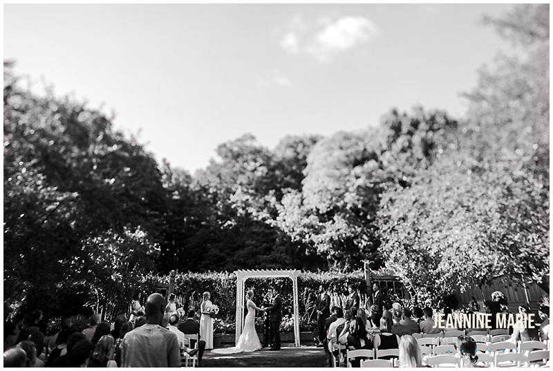 garden ceremony, outdoor ceremony, bride, groom, black and white photo, ceremony site, wedding guests, Minnesota Landscape Arboretum, Hazeltine National Golf Course, Petit Four FIlms, KMB Floral, The Thirsty Whale Bakery, Illuminations by Lori Cole, Instant Request DJ, SM Hair and Makeup, The Wedding Shoppe, Men's Wearhouse, outdoor wedding, garden wedding, blush wedding, Minnesota wedding venues, Twin Cities wedding venues, Minnesota wedding photographer, Saint Paul wedding photographer, Jeannine Marie Photography